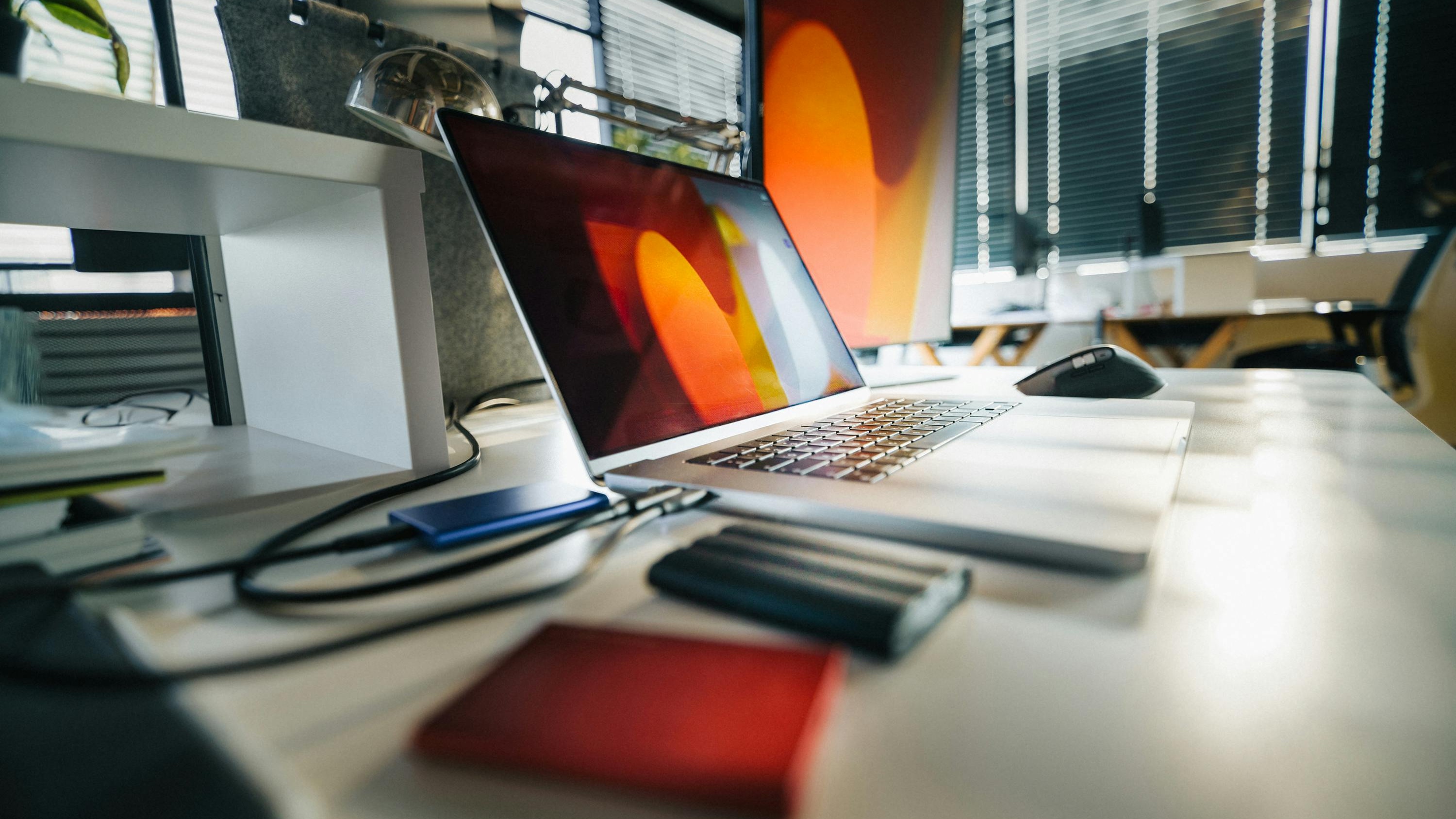Modern workspace with laptop displaying professional website